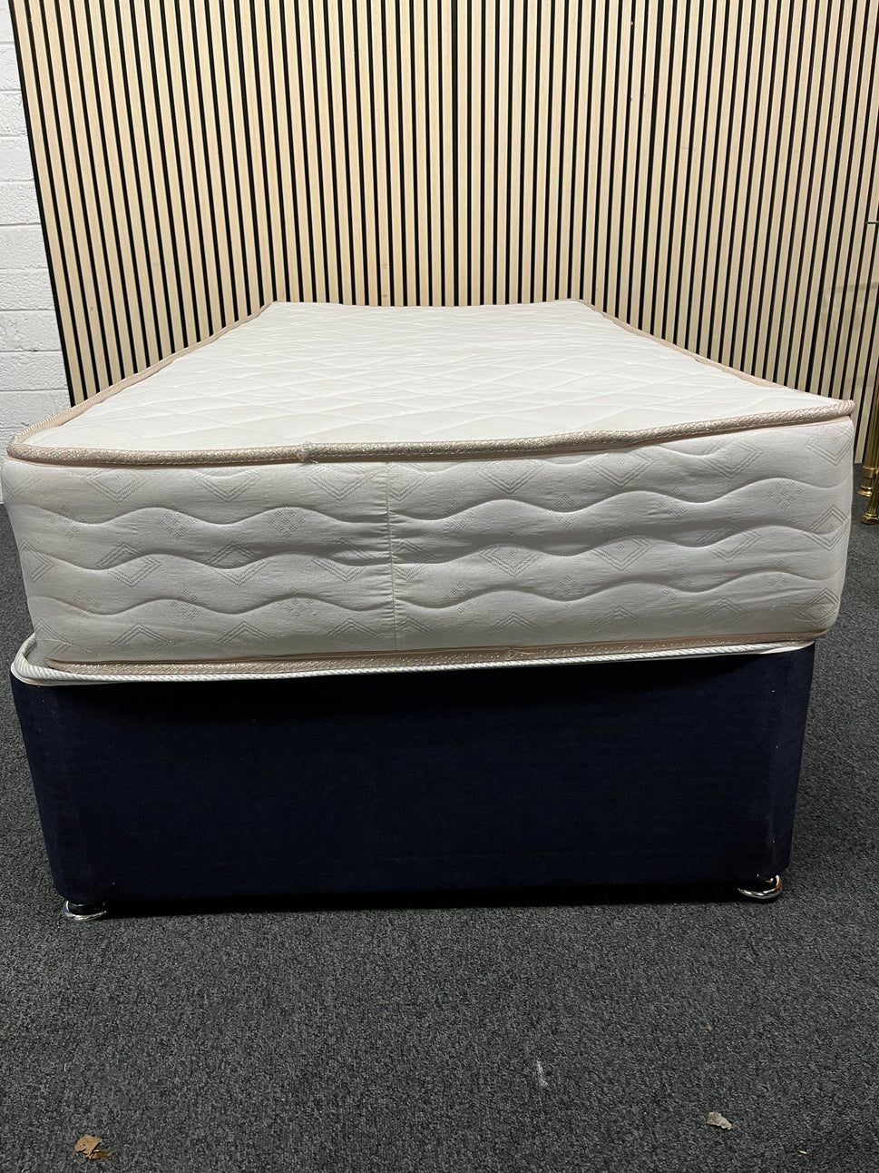 3ft secondhand divan base in navy fabric with castors