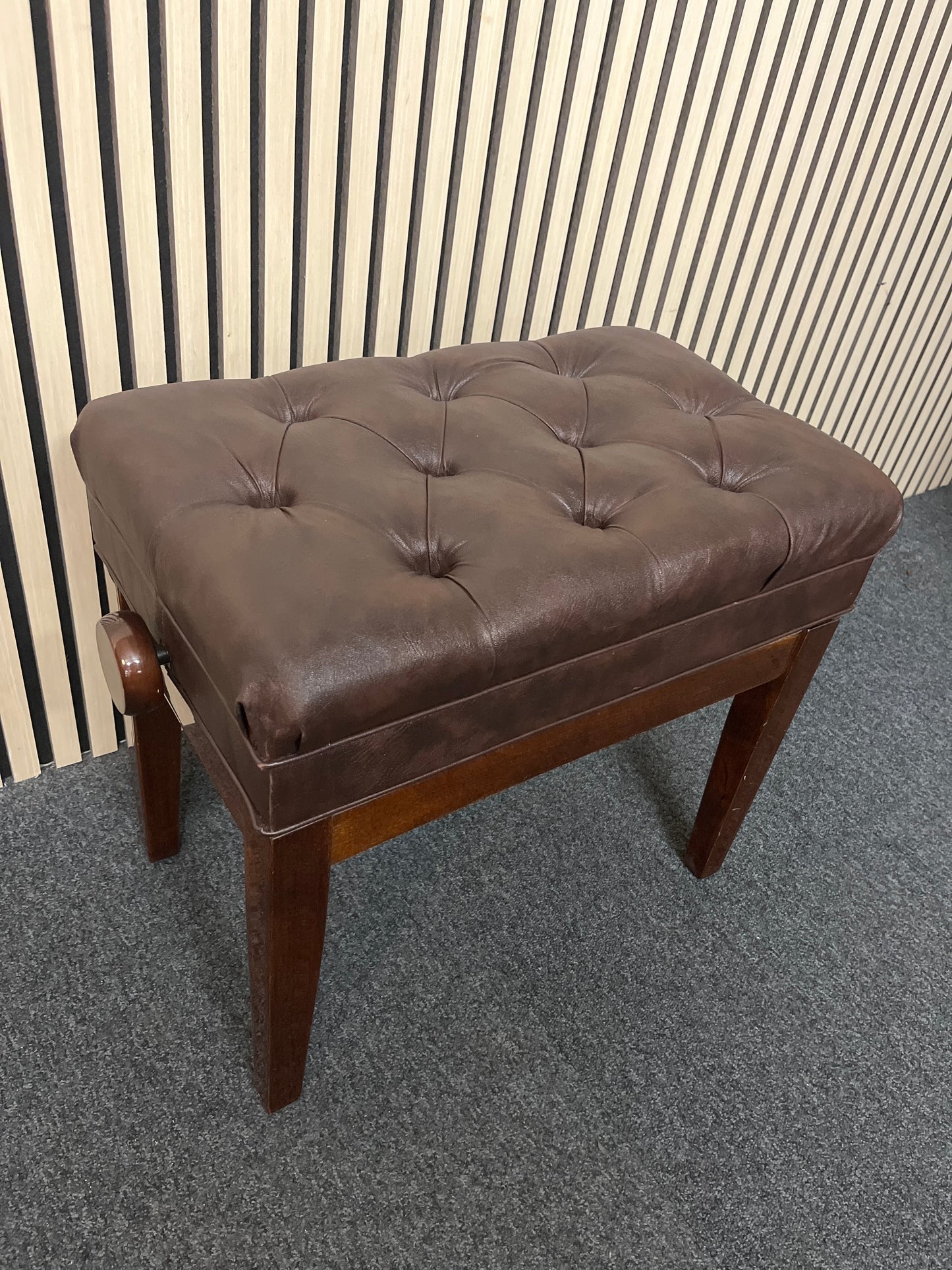 Solid wood frame leather top adjustable piano stool with leatherette seat studded seat and lift up cover with red felt internal fabric 2325