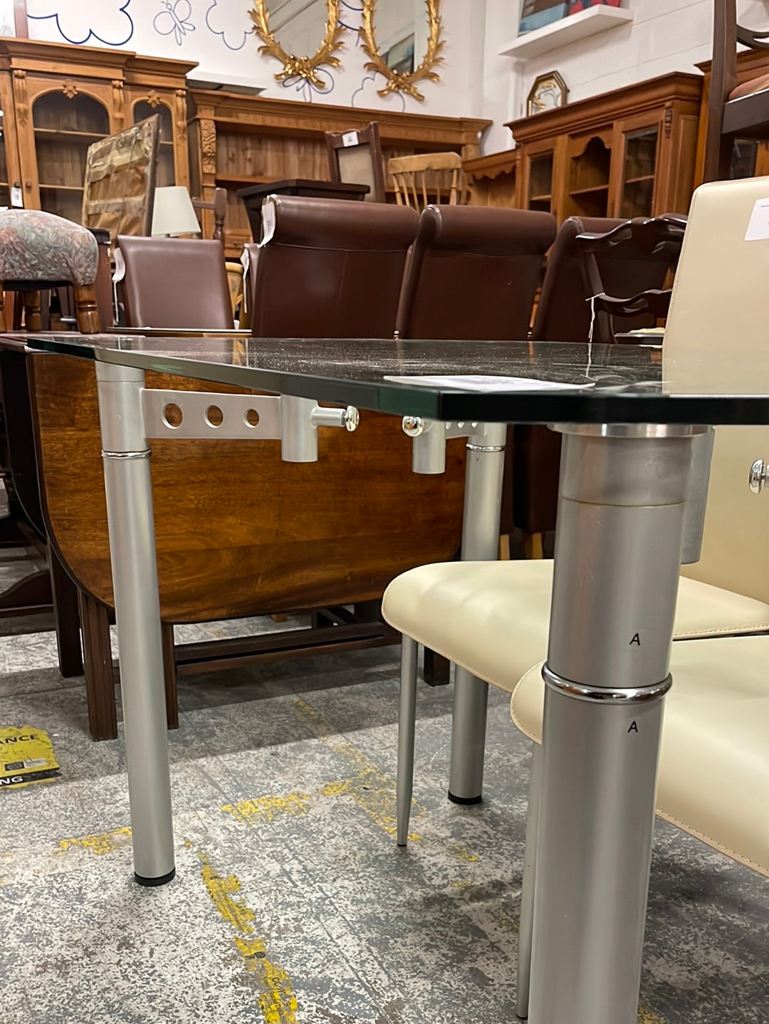 Circular extendable glass and chrome kitchen table CJM Furniture