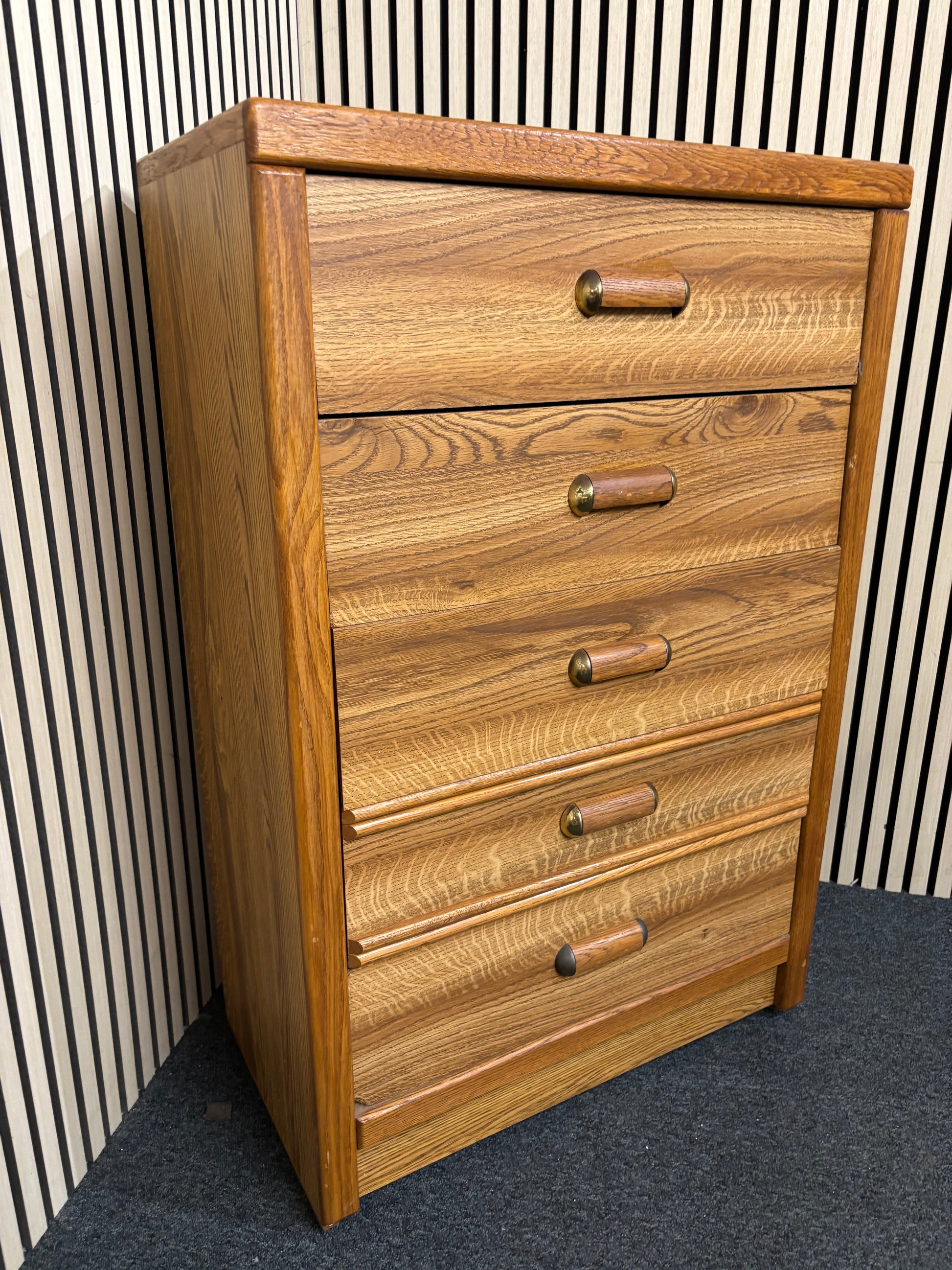 Tall wooden chest with five drawers and rounded handles