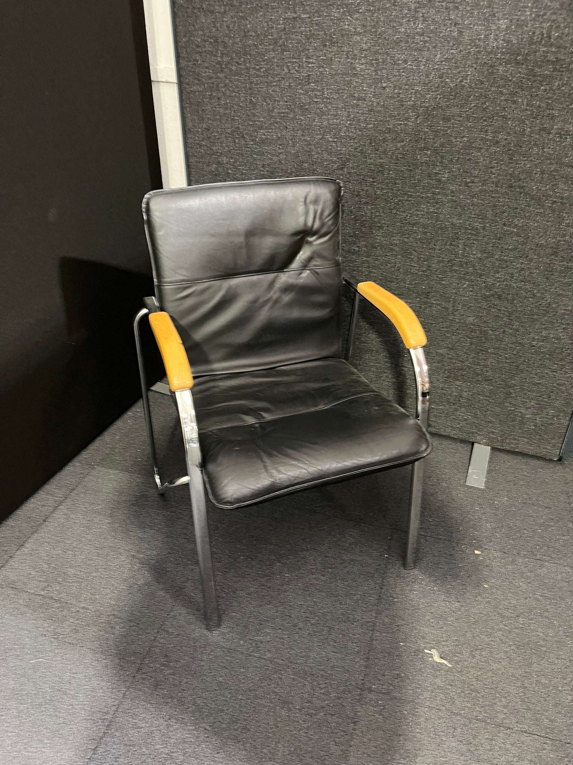 Black leatherette chrome framed stacking chair with wooden arms  1425