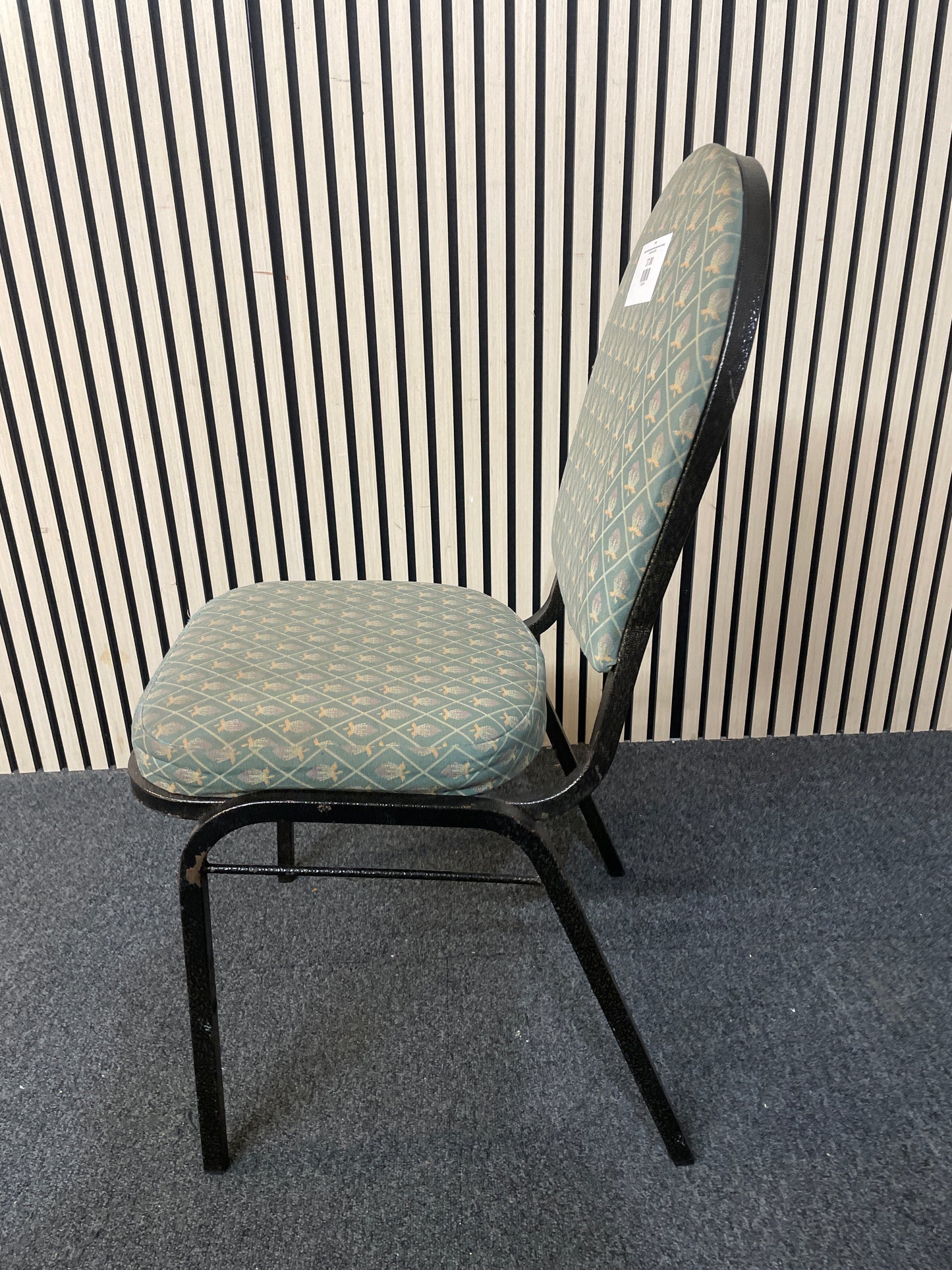  black metal framed green fabric seat and back stacking banquet chair 2425