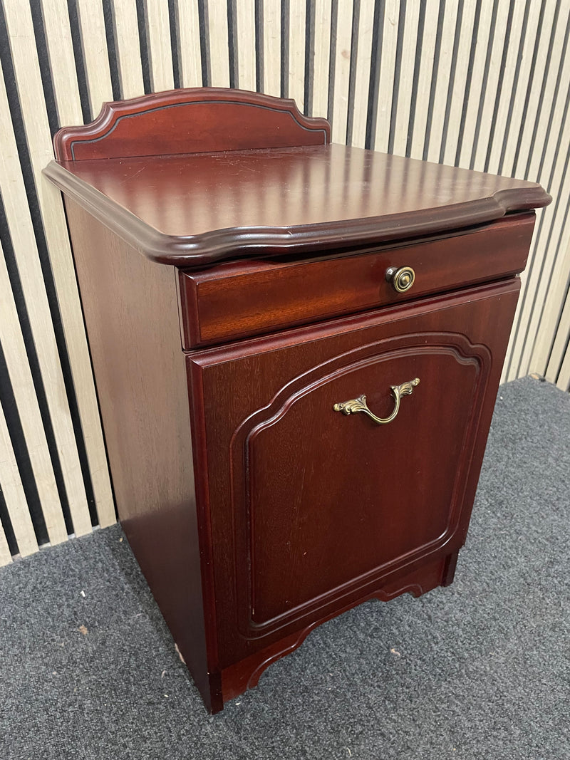 Traditional dark wood nightstand with decorative edges and single drawer.  44667