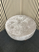 Large circular ottoman in grey velvet with button-tufted detailing.  44520