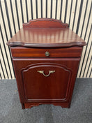 Traditional dark wood nightstand with decorative edges and single drawer.  44667