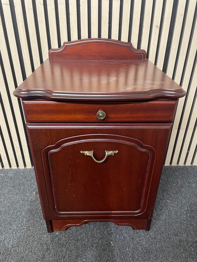 Traditional dark wood nightstand with decorative edges and single drawer.  44667