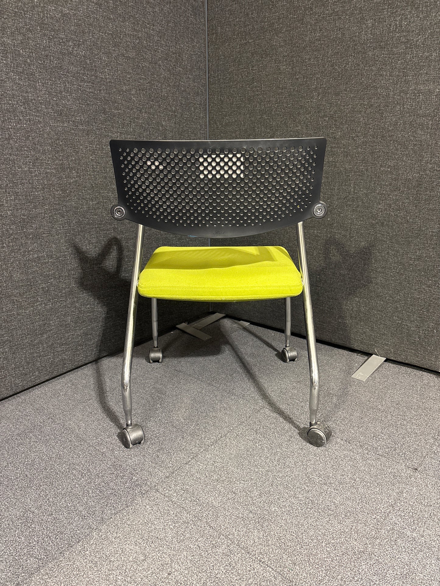 Black and green meeting chair on castors