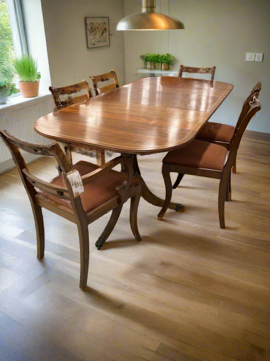Oval shaped mahogany extendable table on castors with matching  2 carver and 4 dining chairs with red fabric seat 2125