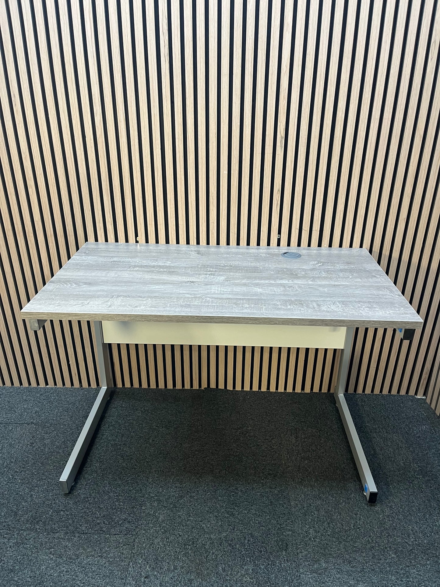 110 x 600 Straight desk  with Grey Oak finish and grey metal cantilever desk