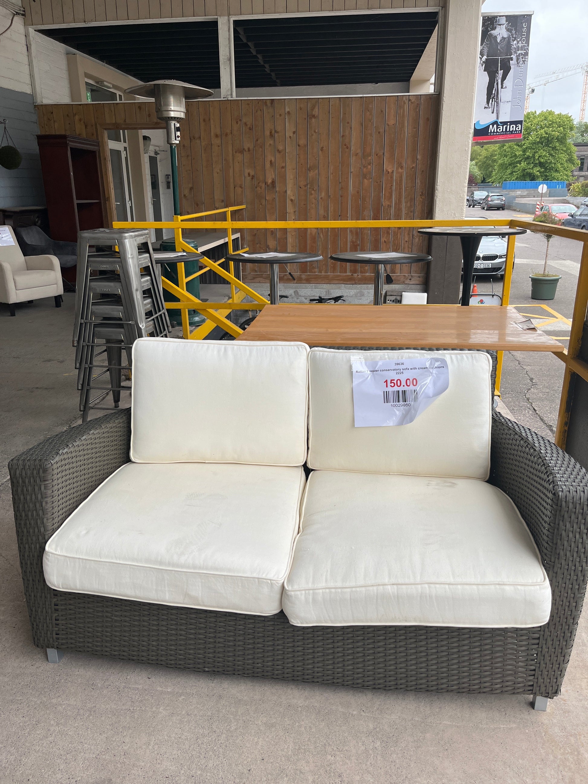 Rattan 2 seater conservatory sofa with cream cushions 2225