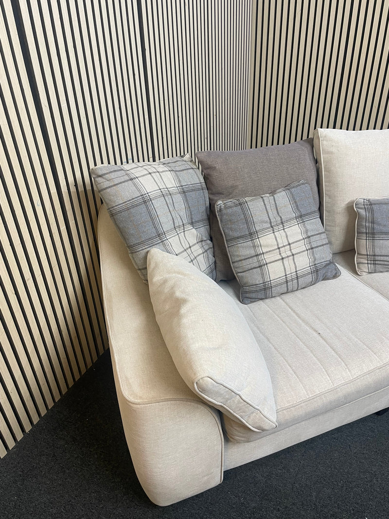 Large curved three-seater fabric sofa with matching scatter cushions.  44592