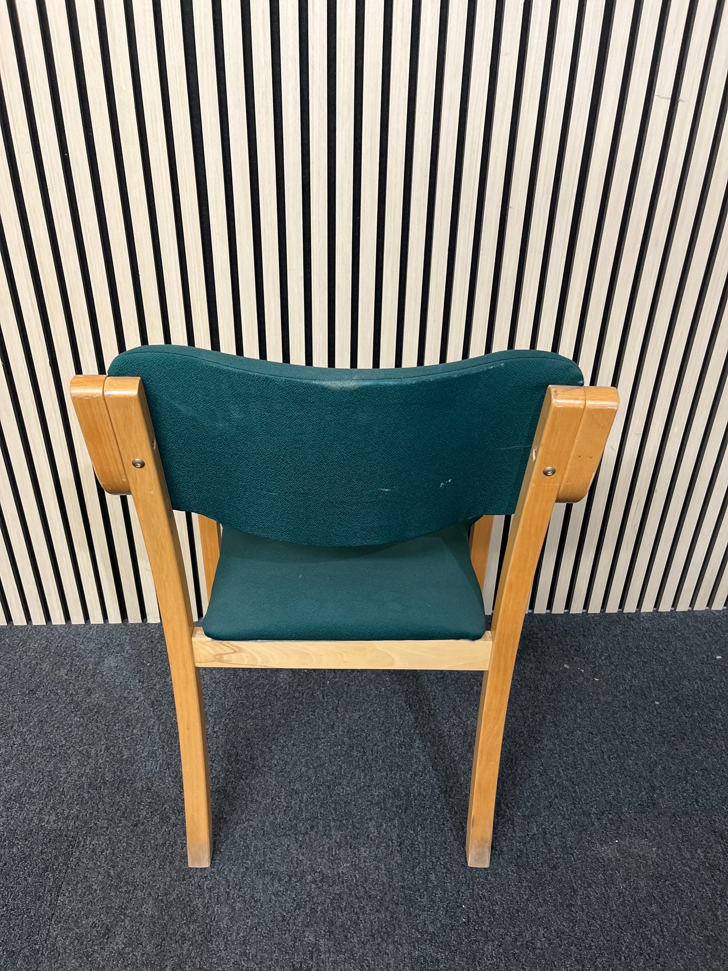 solid beech framed stacking chair with arms, green fabric seat and back