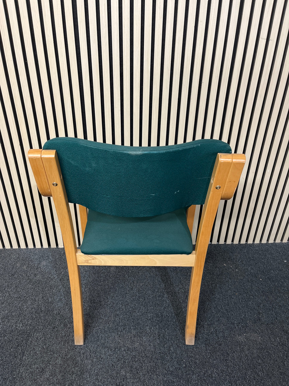 solid beech framed stacking chair with arms, green fabric seat and back