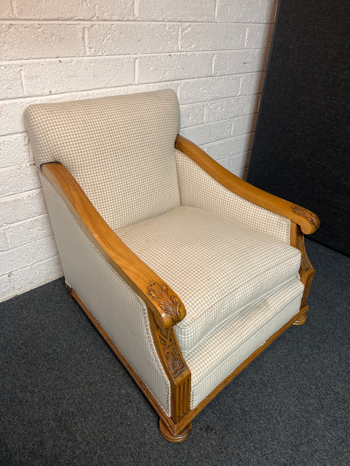Antique solid oak framed ornate carved detail wing back armchair with  cream chequered fabric 2225