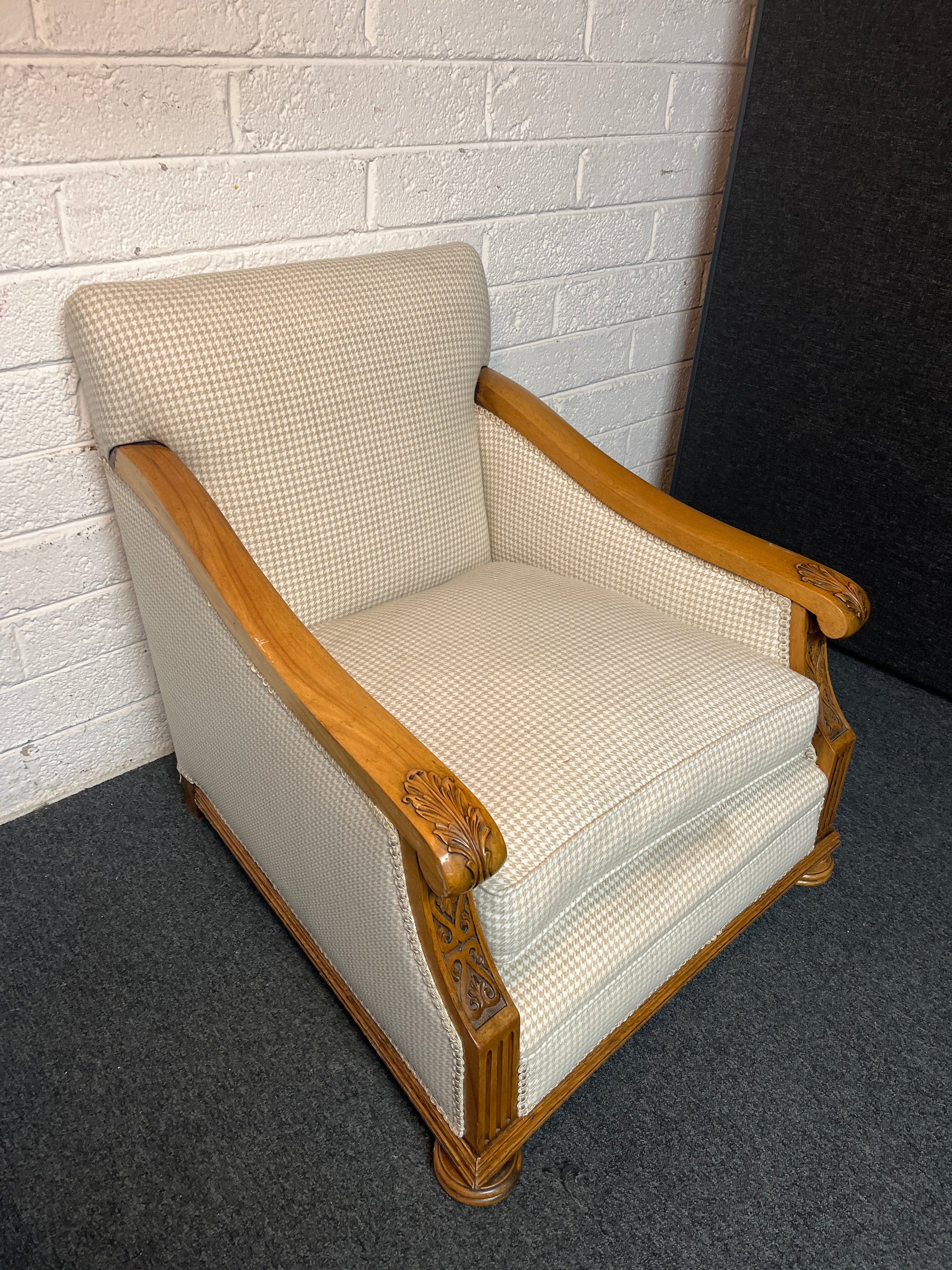 Antique solid oak framed ornate carved detail wing back armchair with  cream chequered fabric 2225
