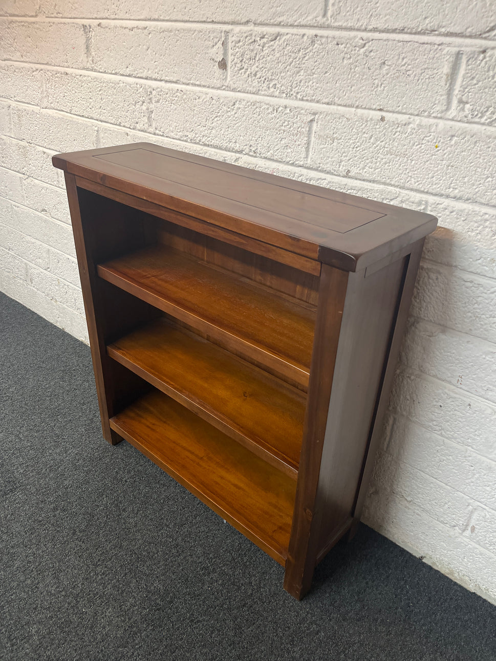 Low solid dark wood stained open bookcase (H 80 x W 75 x D 25 cm) 1325