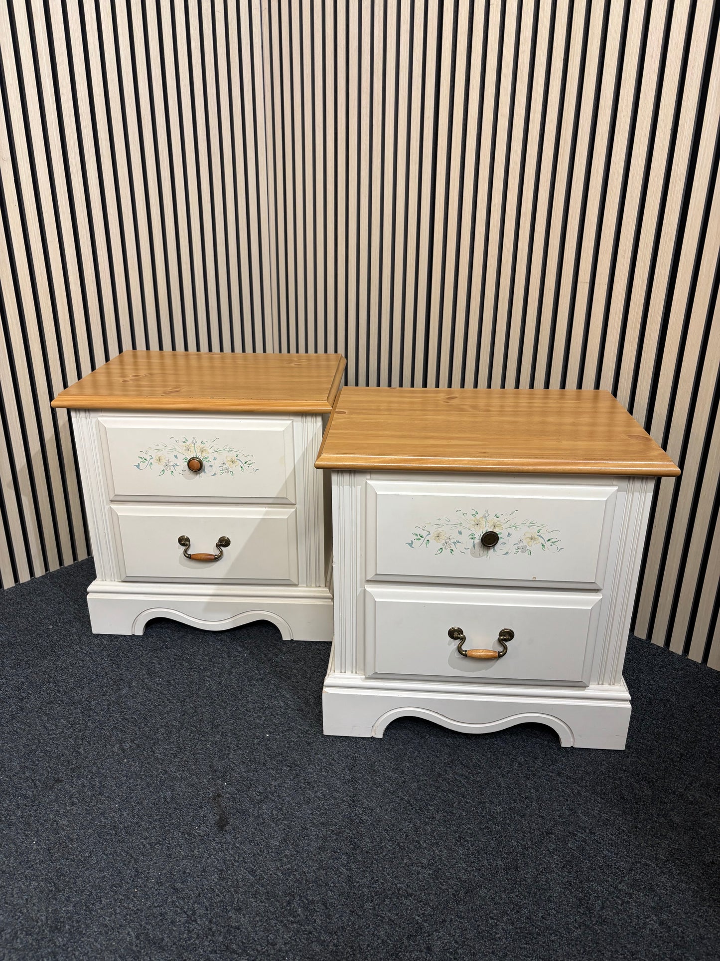 White nightstand with floral detailing and two drawers