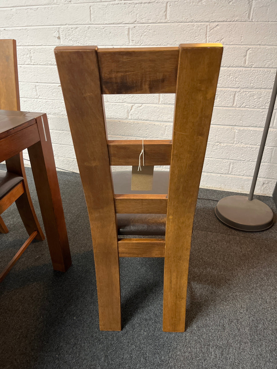 Solid  dark wood stained kitchen table (W 1200 x L 750 mm) with 4 no. solid wood chairs with black leatherette seat cushion 1225