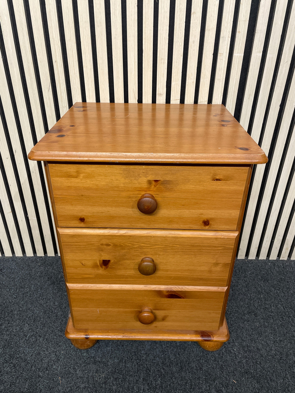 Solid pine bedside chest featuring three drawers with round knobs.  44406