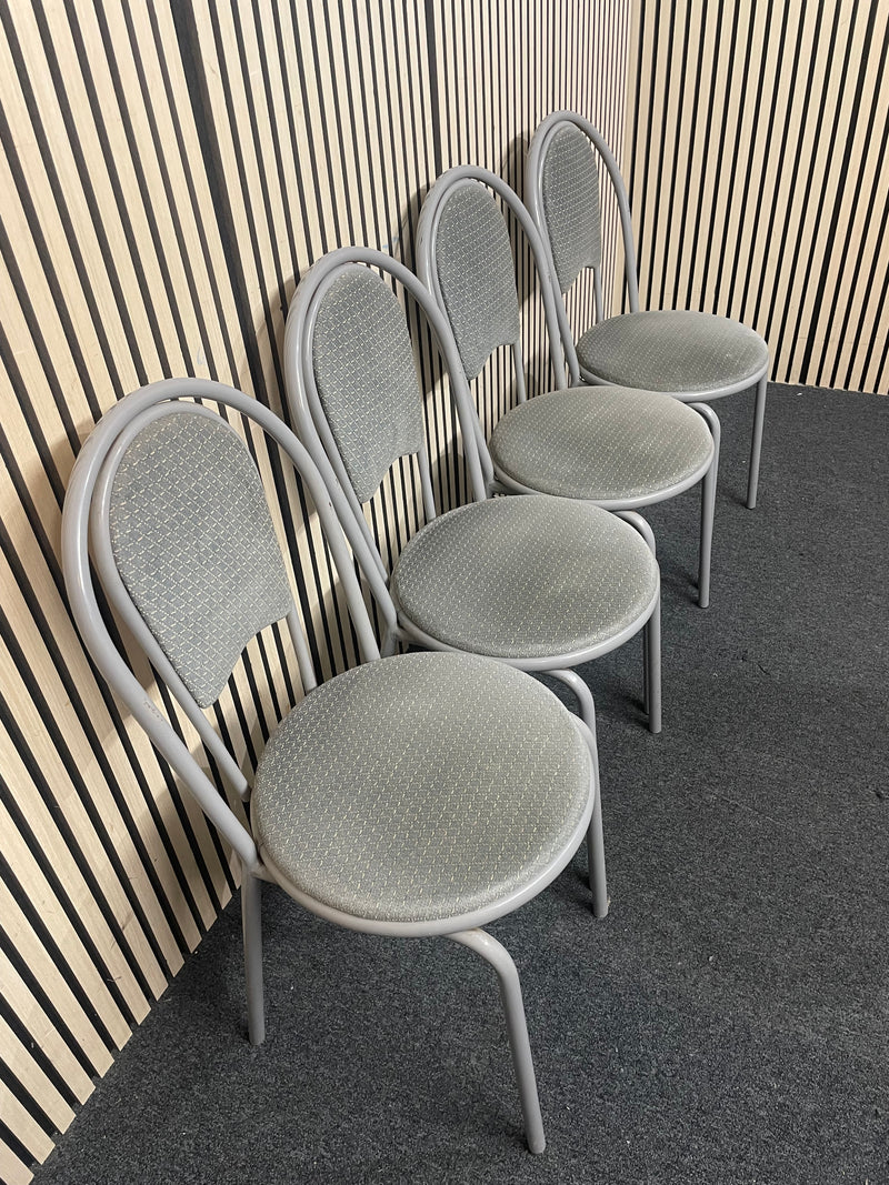 White circular plastic top table with 4 grey metal dining chairs   44652