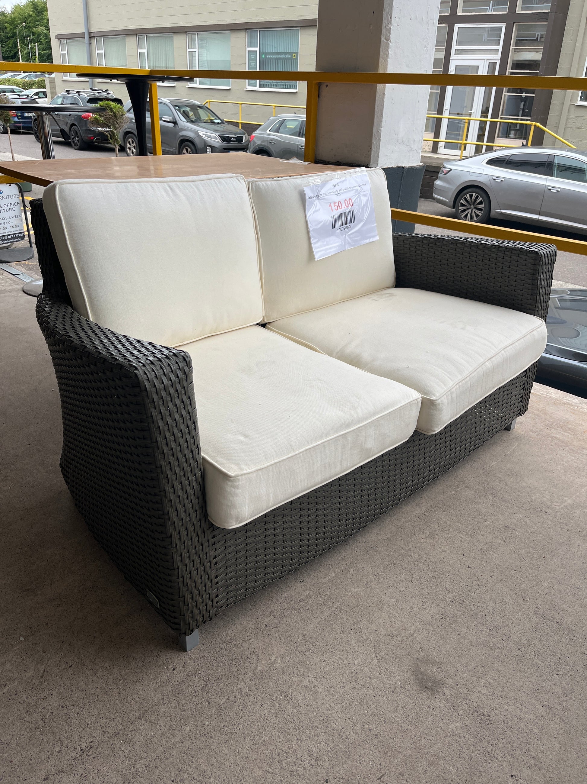 Rattan 2 seater conservatory sofa with cream cushions 2225