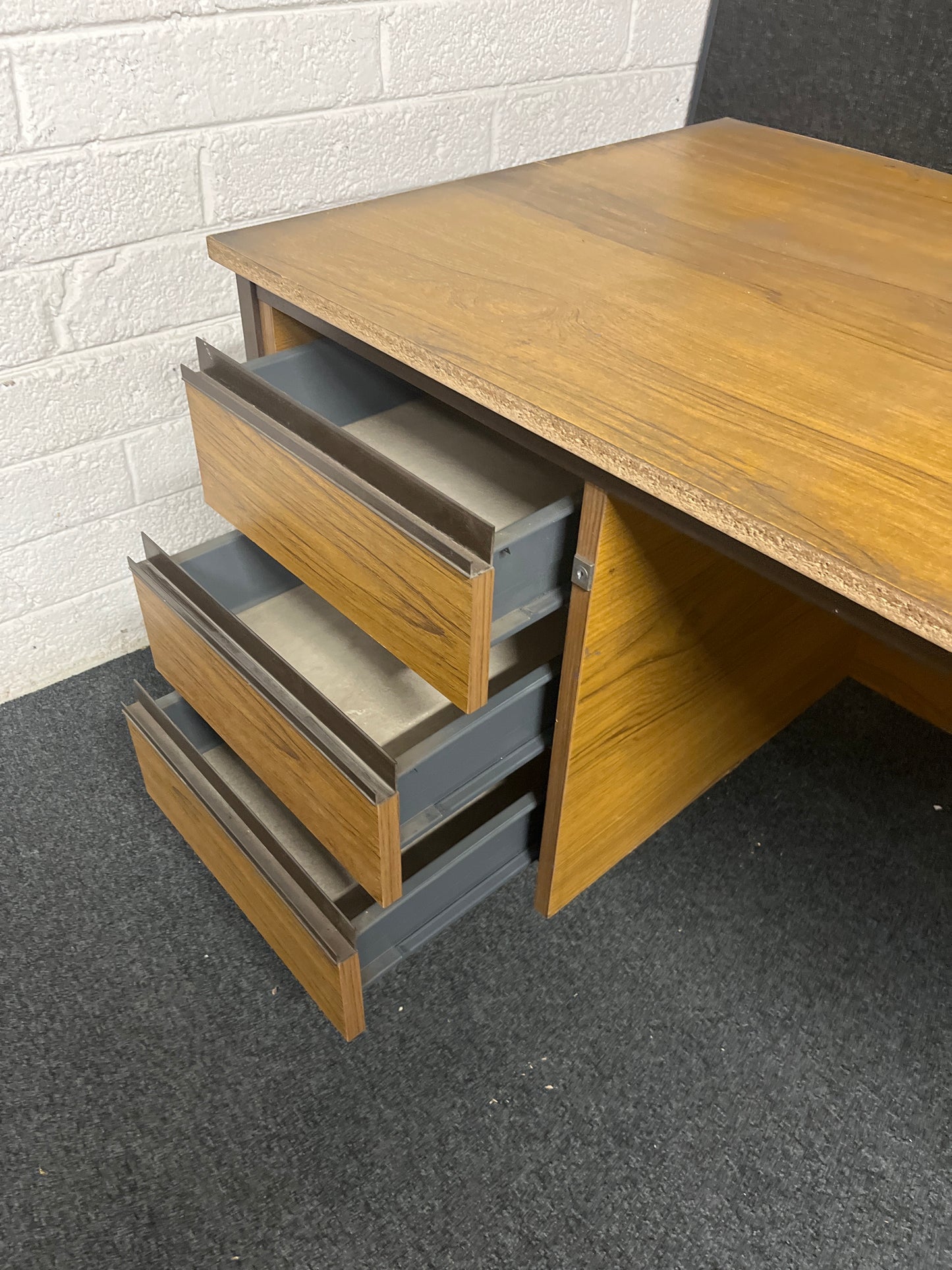 SECONDHAND teak laminate desk with fixed drawers on RHS
