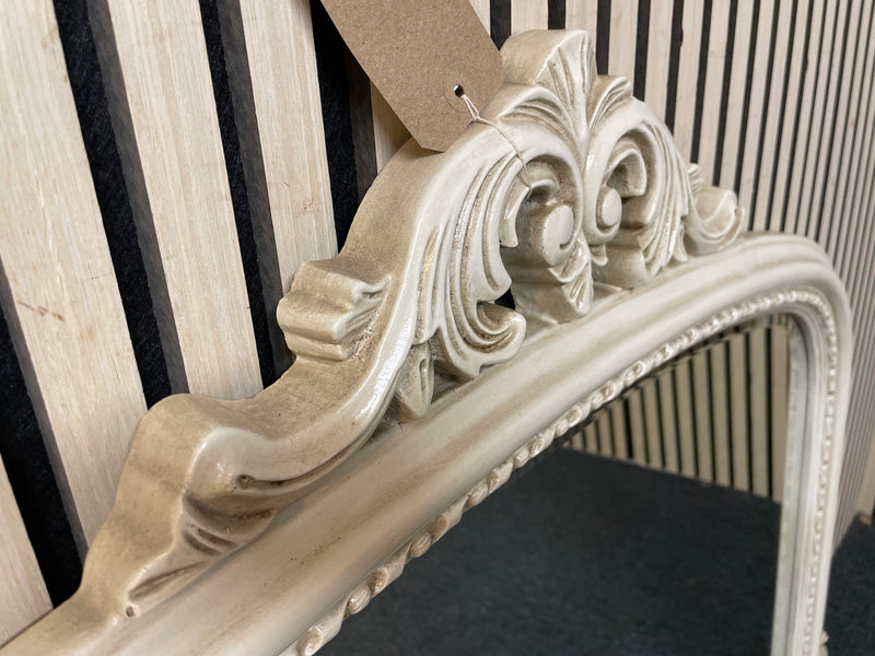 Large arched wall mirror with decorative scrollwork cream frame. (H 92 x W 125 cm)  44576
