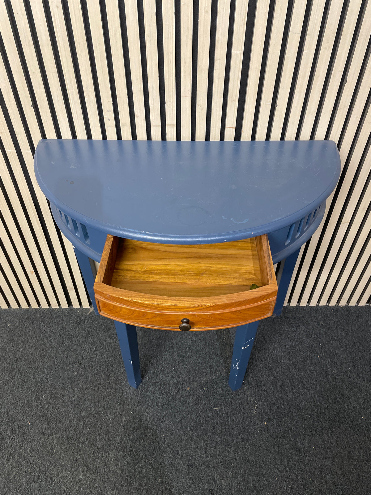 Half-moon wooden hallway table with a small central drawer.  44404