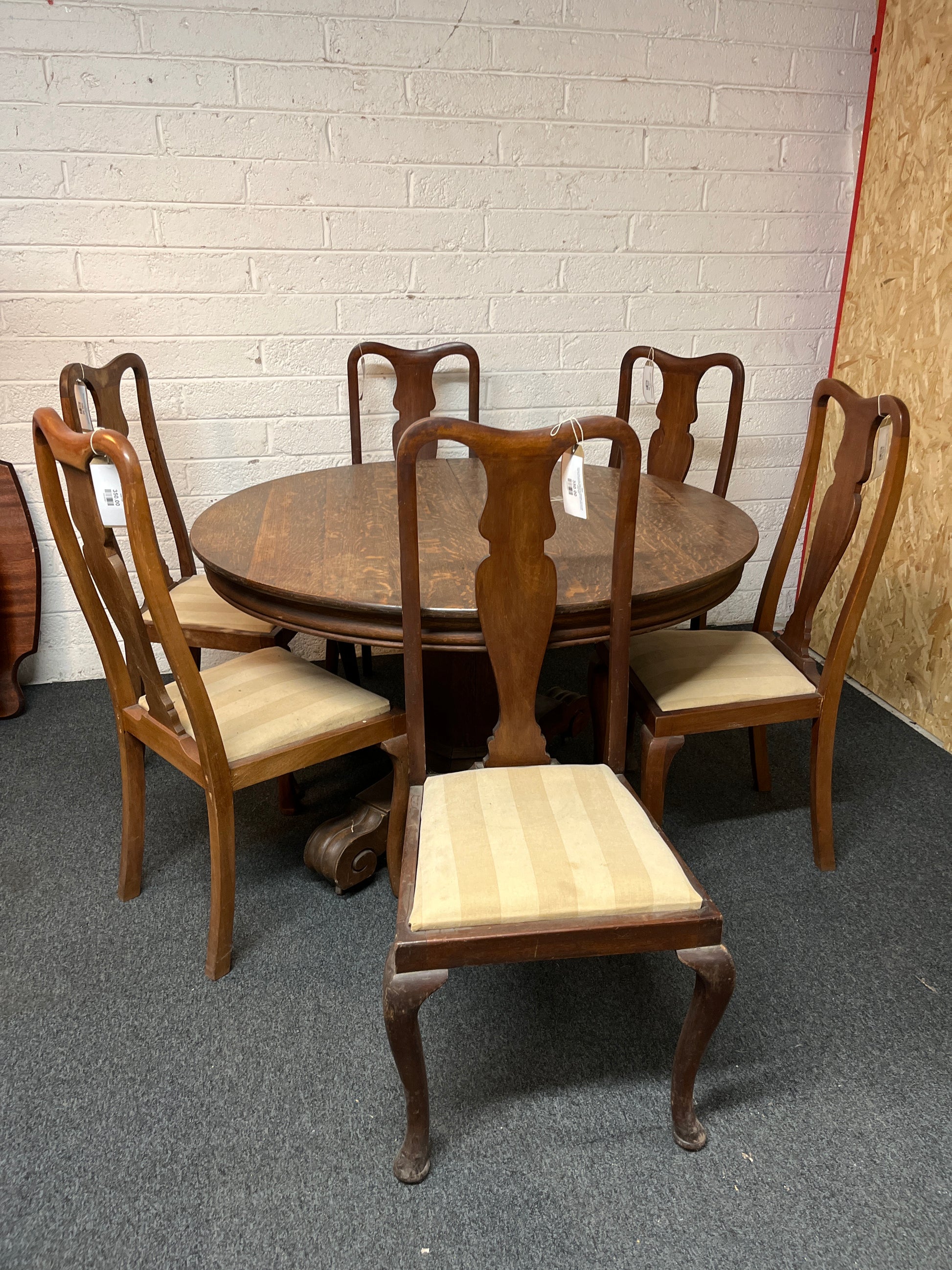 Stained oak circular table (H 78 x Diameter 123 cm) with high back stained oak dining chairs with striped cream seats 1325