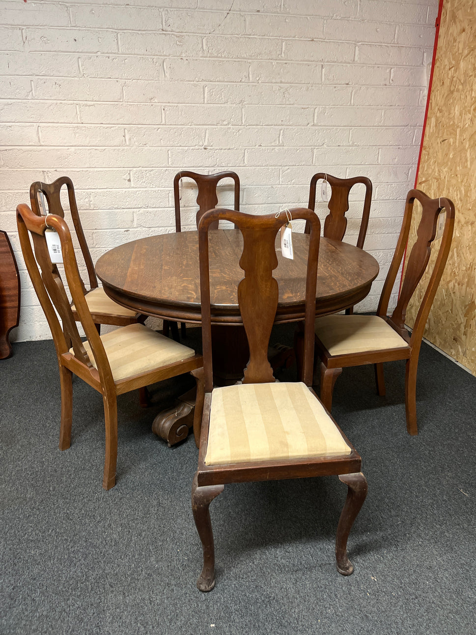 Stained oak circular table (H 78 x Diameter 123 cm) with high back stained oak dining chairs with striped cream seats 1325