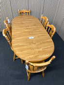 Oak laminate oval extendable dining table with 6 no. matching solid wood chairs W148 to 188 extended x 87D  44459