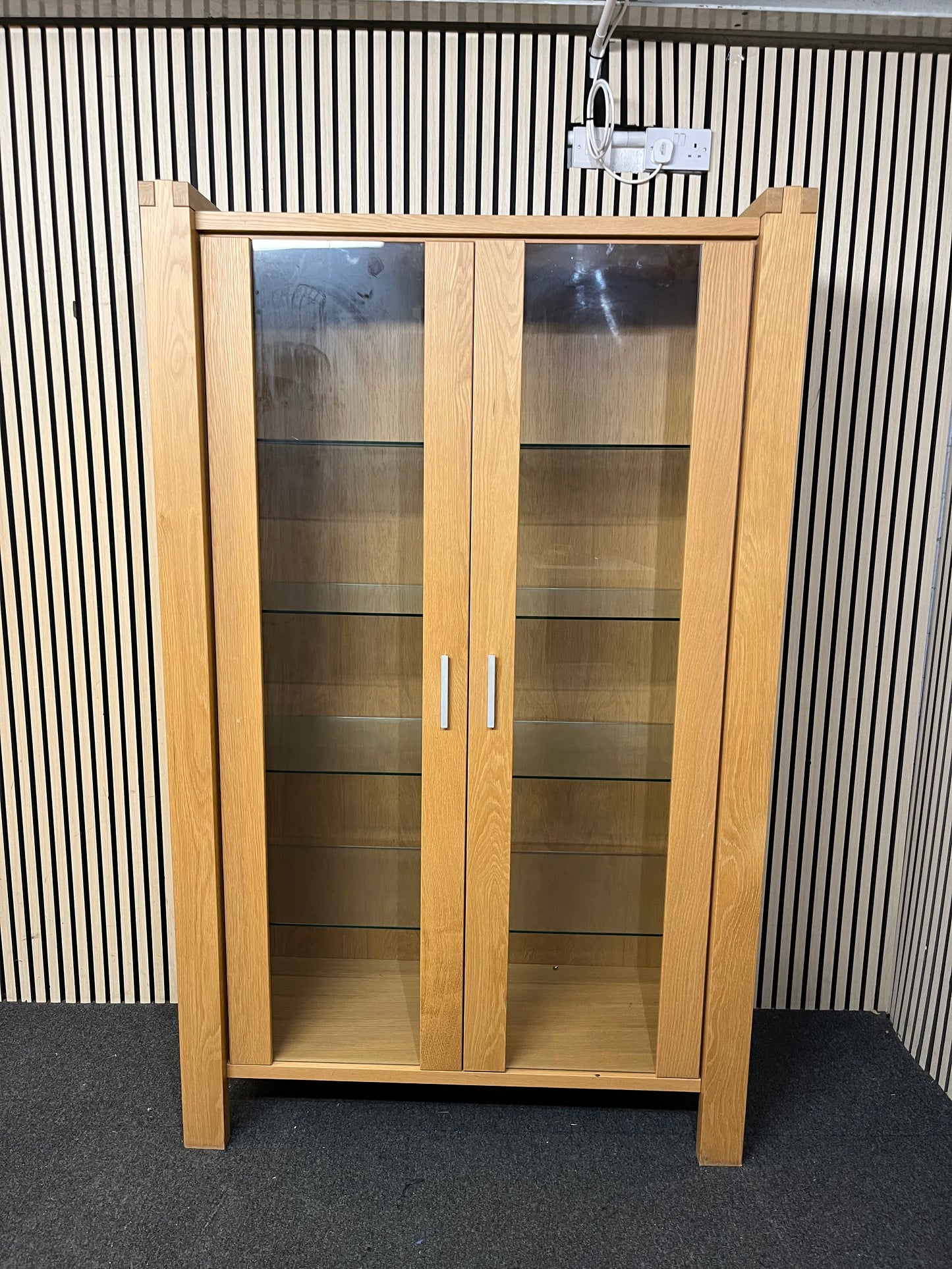 Two-tier wooden display unit with sliding glass panels, good condition. (H 195 x W 119 x D 49 cm)  44241