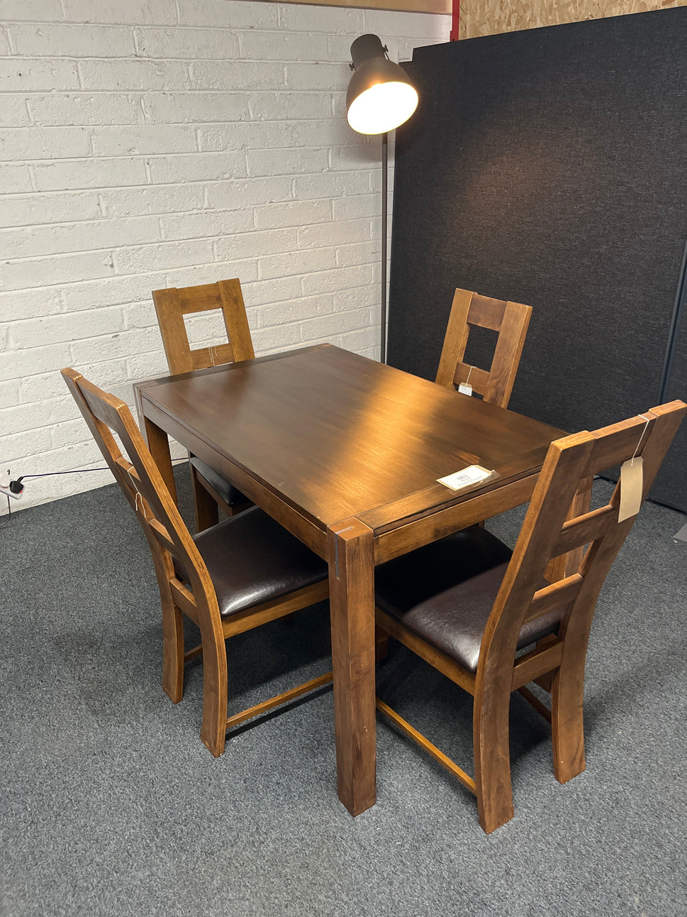 Solid  dark wood stained kitchen table (W 1200 x L 750 mm) with 4 no. solid wood chairs with black leatherette seat cushion 1225
