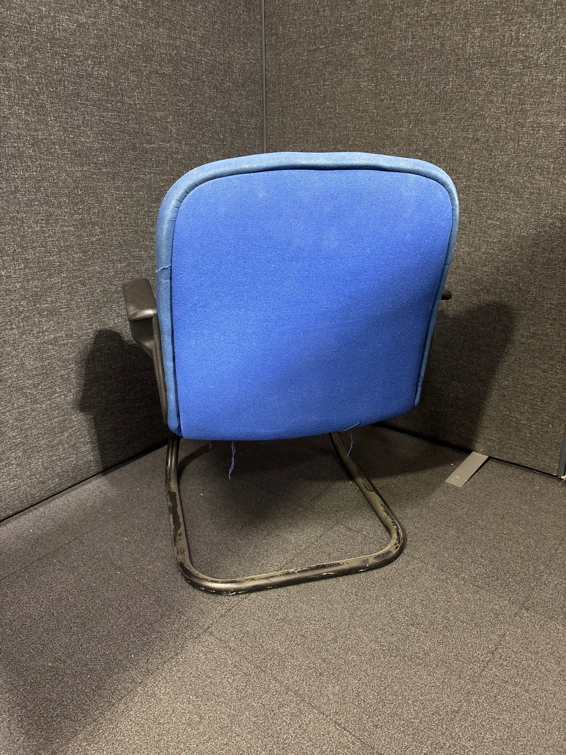Blue fabric low back cantilever black framed meeting chair with arms