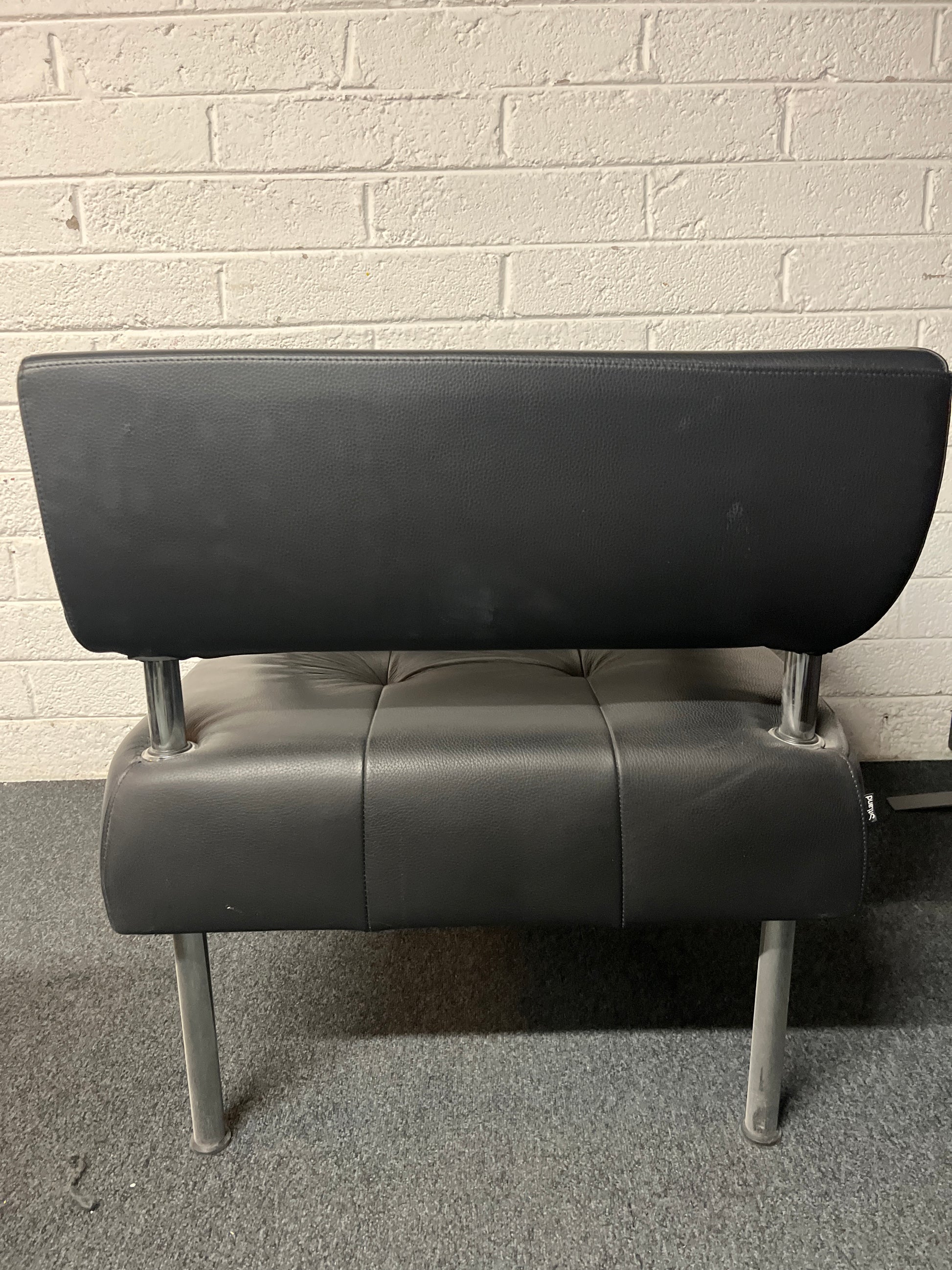 SECONDHAND Black leather chrome frame reception armchair