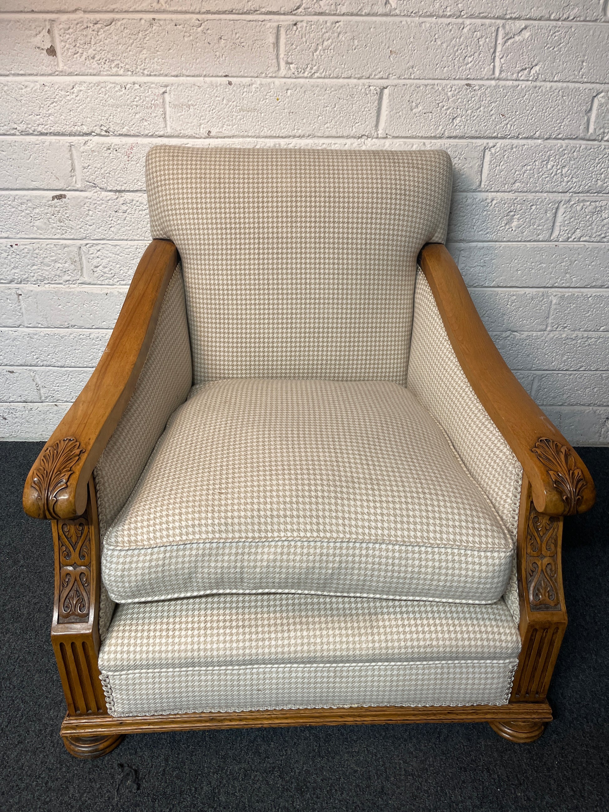 Antique solid oak framed ornate carved detail wing back armchair with  cream chequered fabric 2225