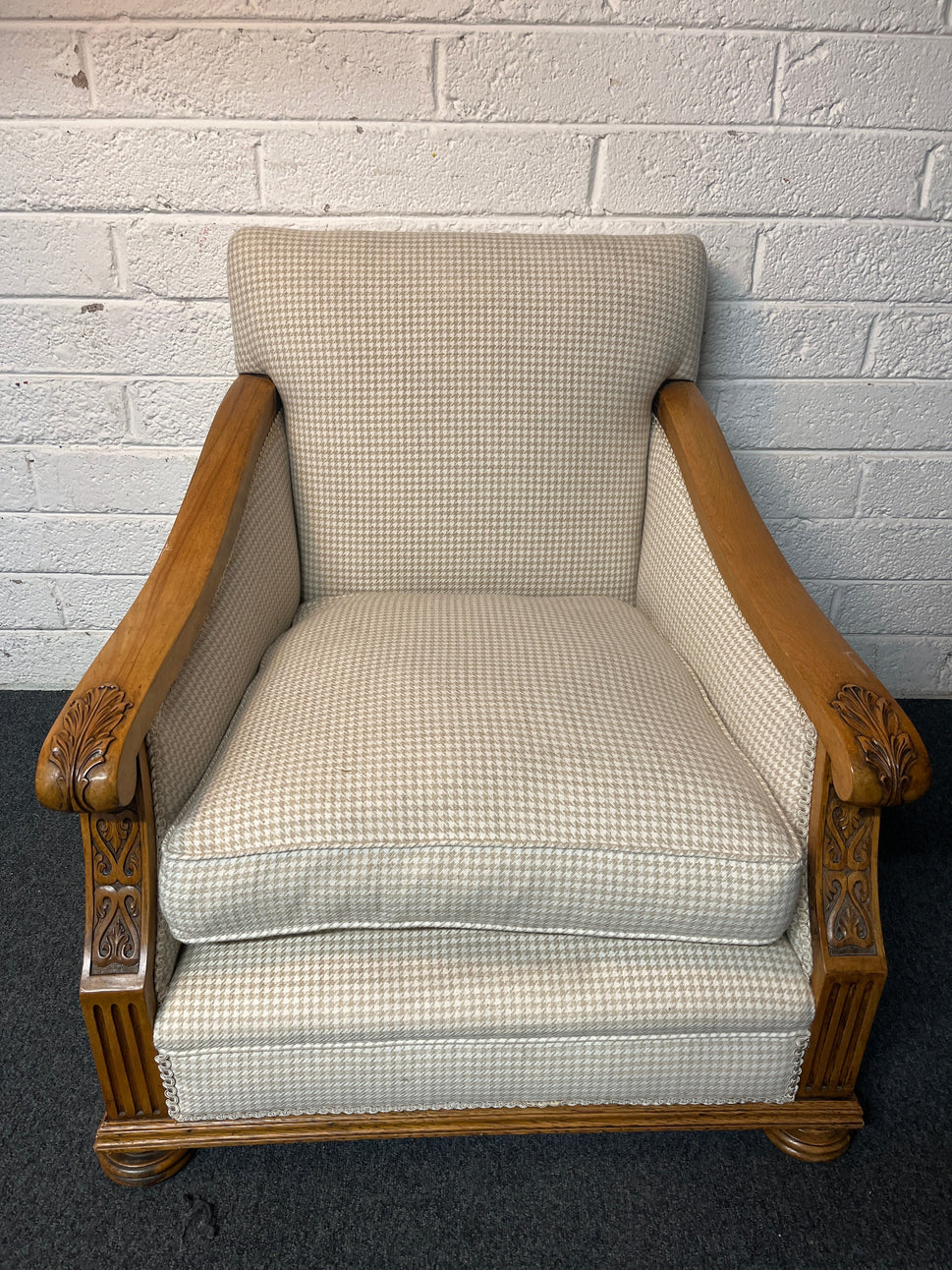 Antique solid oak framed ornate carved detail wing back armchair with  cream chequered fabric 2225