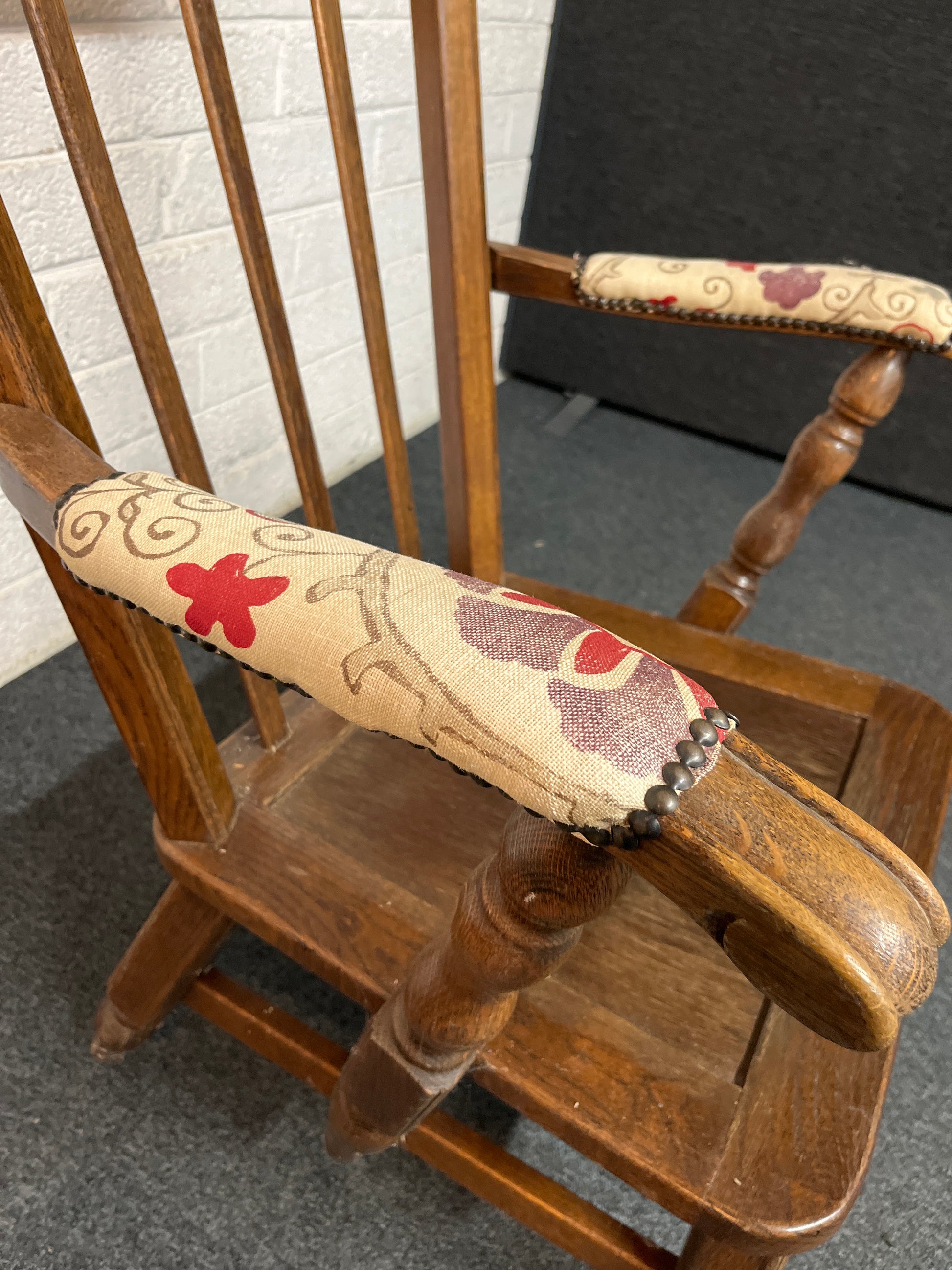 Dark wood stained armchair with padded fabric arms  2225