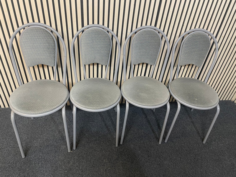 White circular plastic top table with 4 grey metal dining chairs   44652