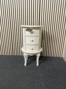 Oval three-drawer bedside locker with cabriole legs and cream finish.  44701