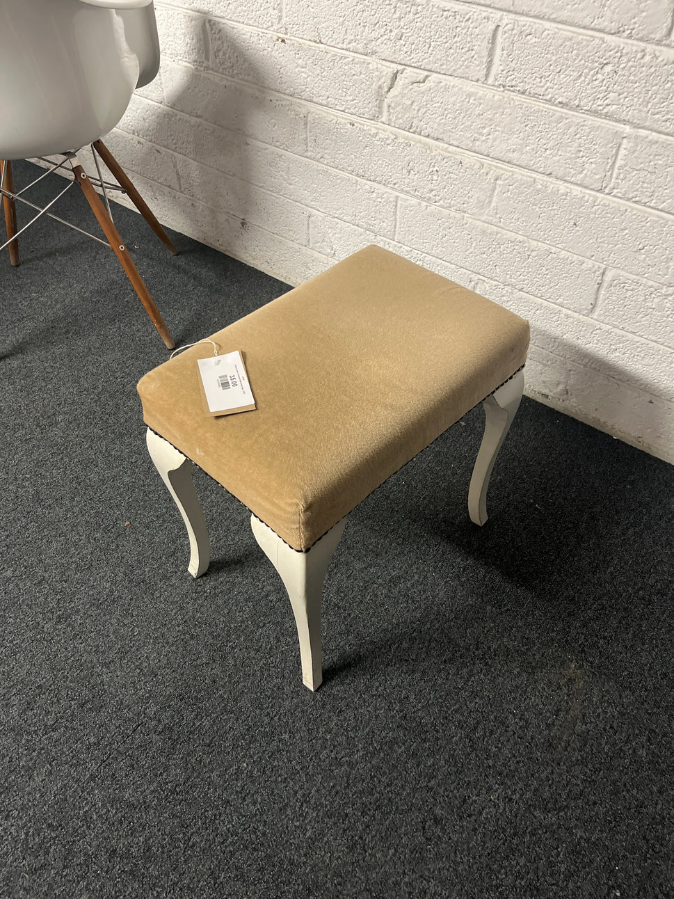 Brown fabric footstool with white legs  1225