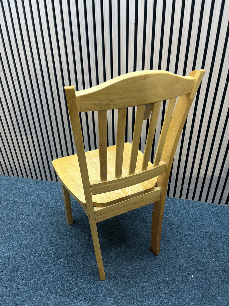 Set of two light wood dining chairs with slatted backrests.  44409