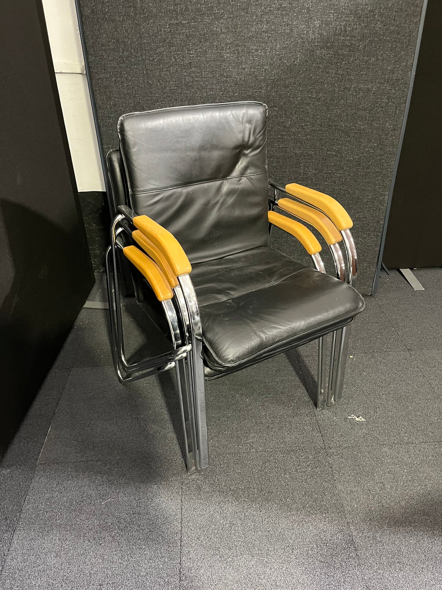 Black leatherette chrome framed stacking chair with wooden arms  1425