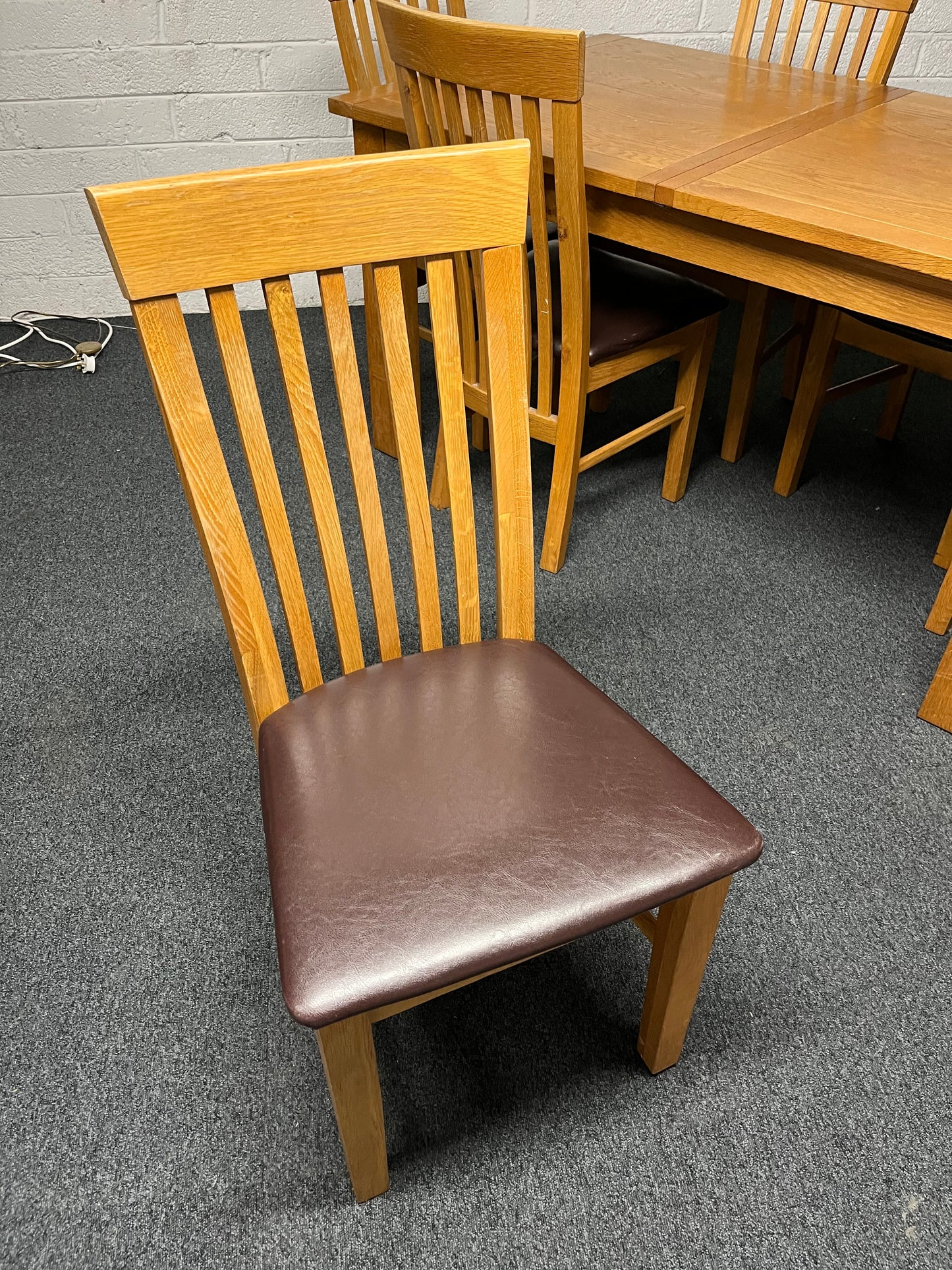 Solid oak extendable dining table (H 780 x W 1500 x D 900 mm) with 6 no. matching chairs with black pu leatherette cushion  1225