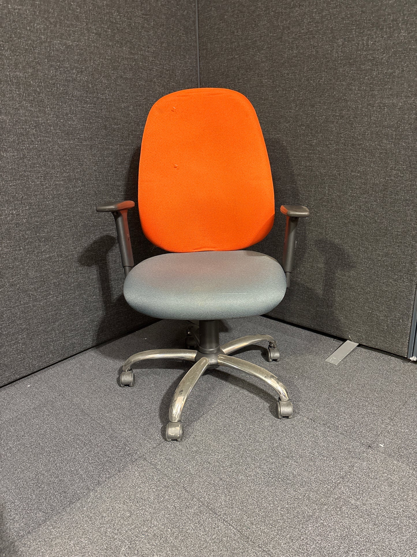 Two tone orange and grey high back swivel chair with height adjustable arms