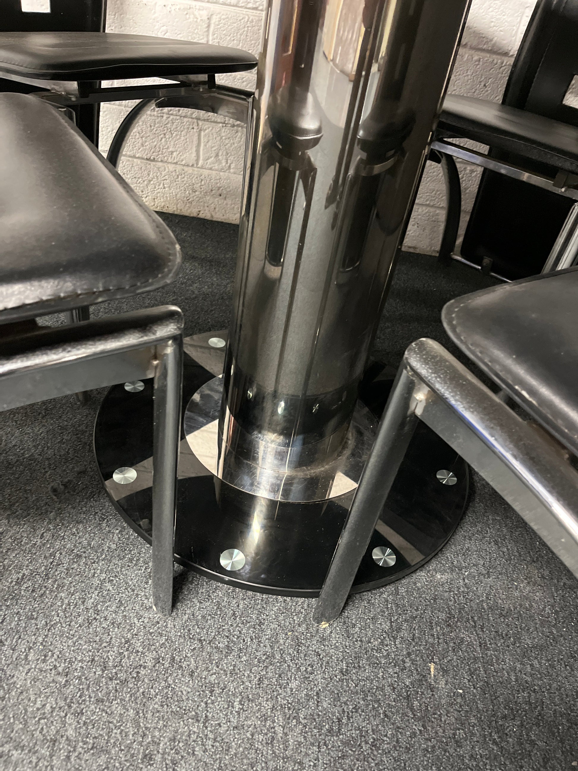Black glass circular kitchen table (radius x 1060 mm), central base with 4 no. high back black leatherette and chrome dining chairs  1225