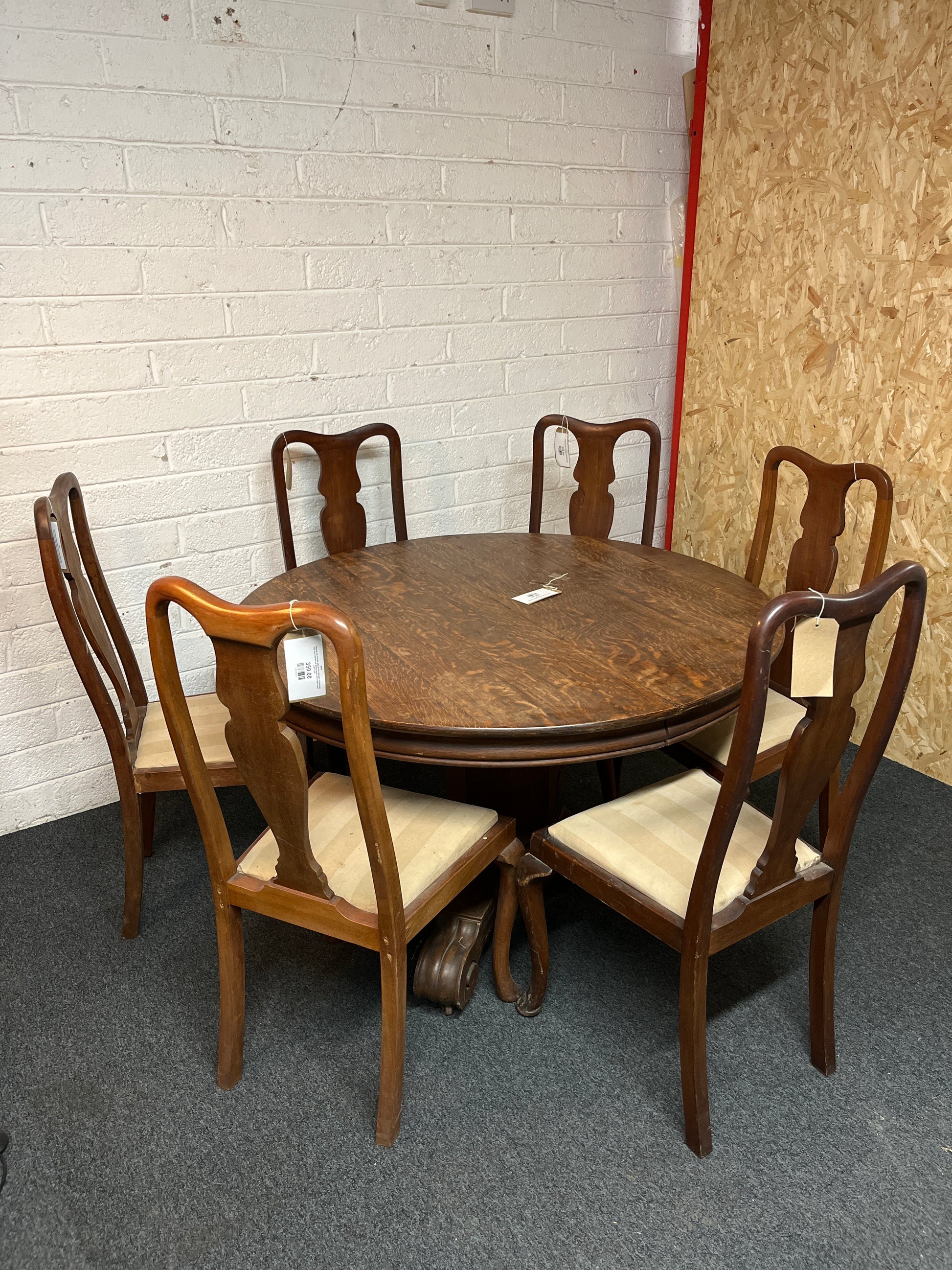 Stained oak circular table (H 78 x Diameter 123 cm) with high back stained oak dining chairs with striped cream seats 1325