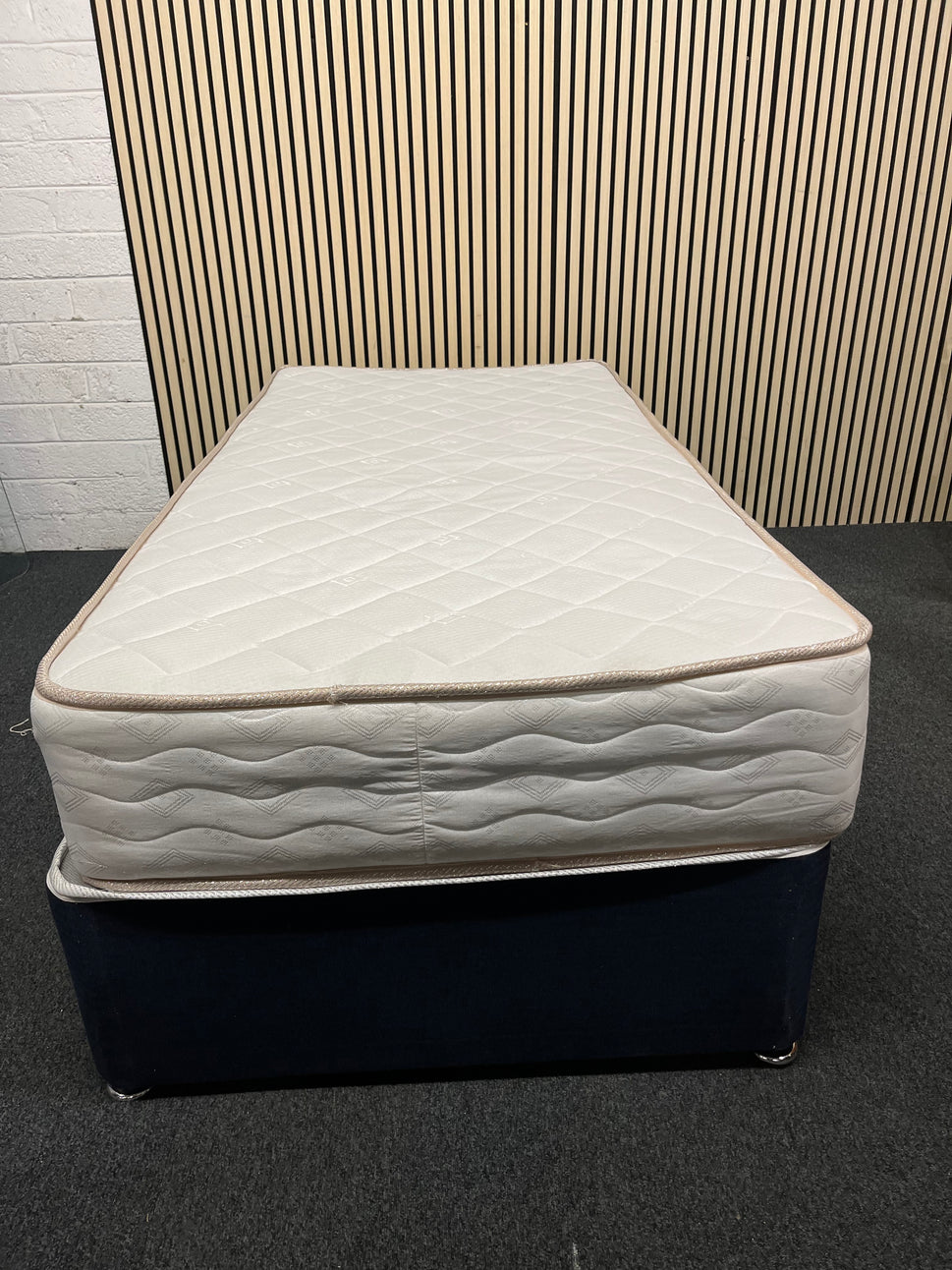 3ft secondhand divan base in navy fabric with castors