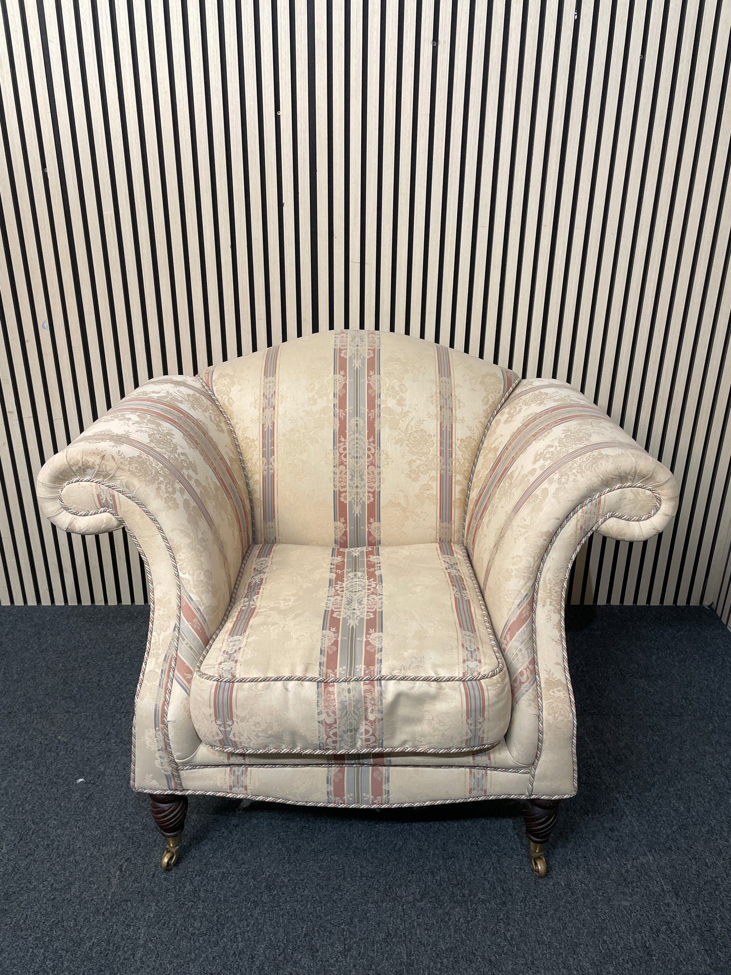 Ornate roll back stripped fabric armchair with castors 2425