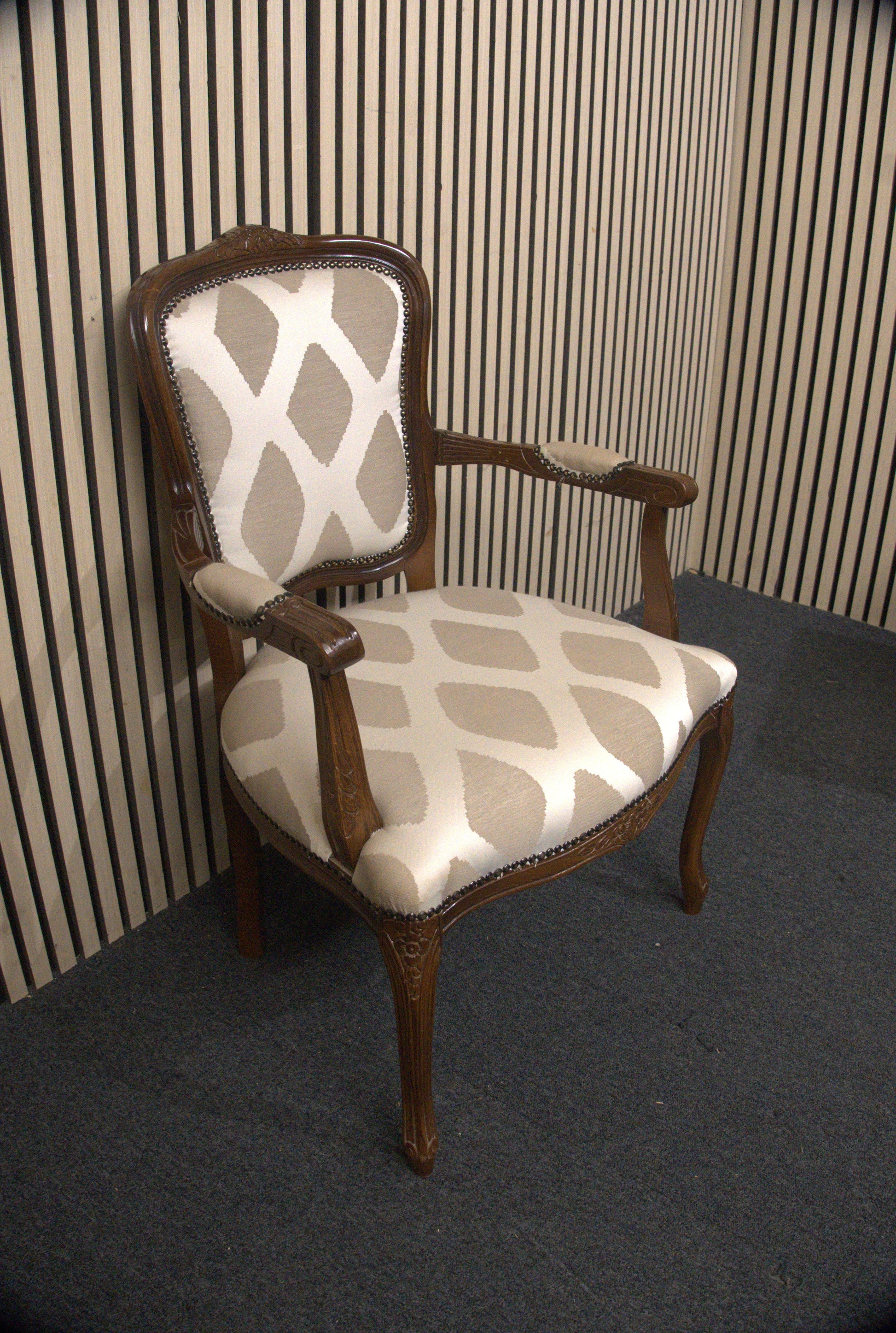 Solid mahogany Limogue chair with cream fabric pattern and stud details   44340